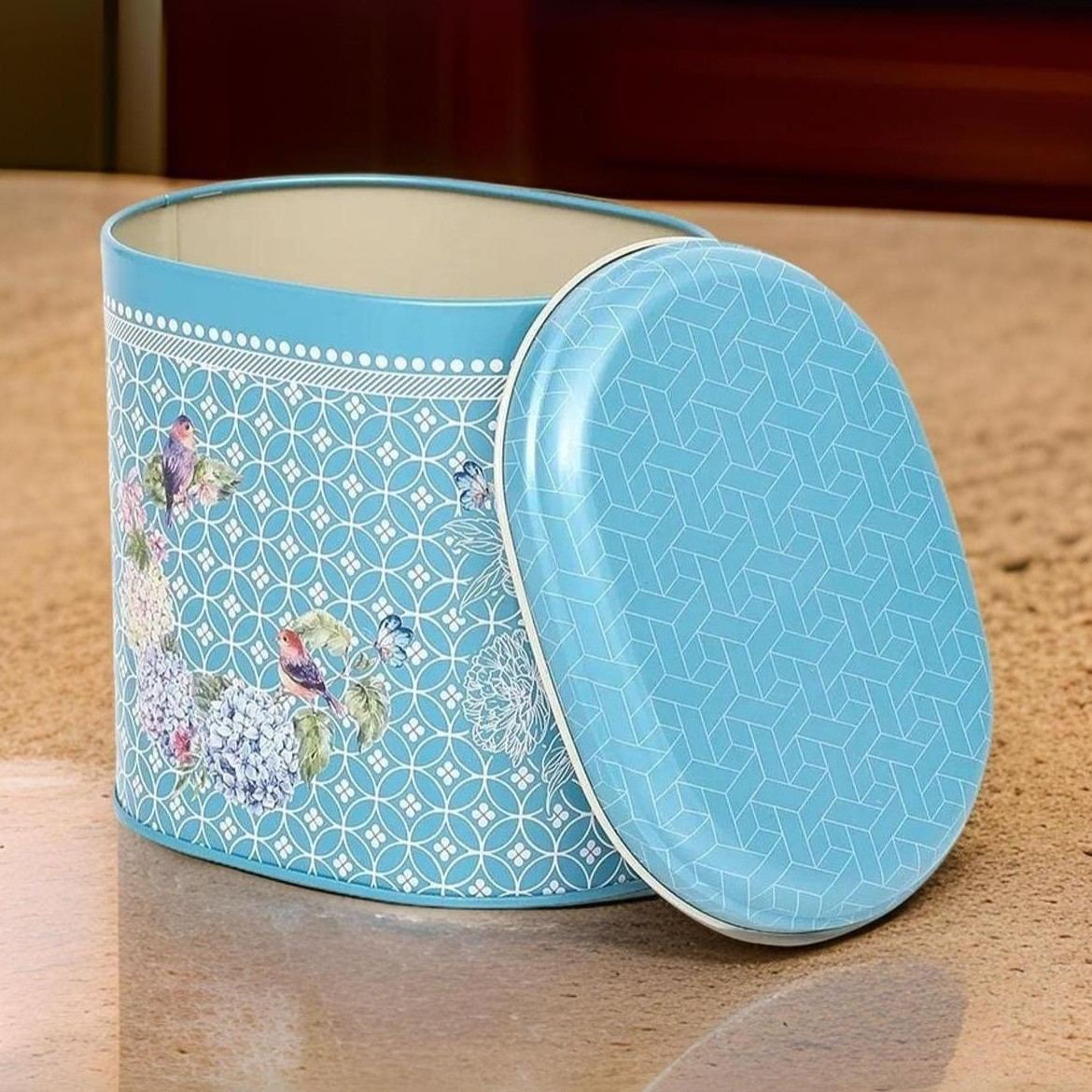 Oval Metal Tin – 140 x 120 x 130 mm (1.4L)  Floral Harmony with Birds on Geometric blue